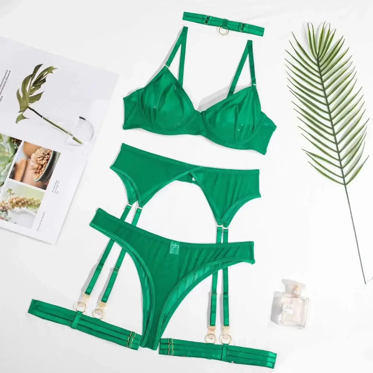 Green lingerie set with bra, briefs and garter pieces