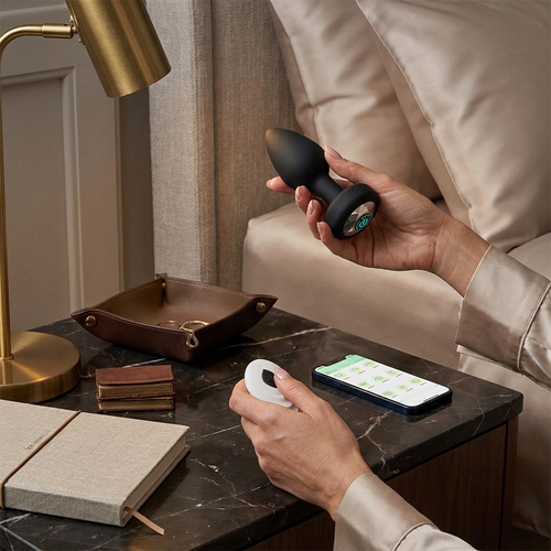 Premium lifestyle image of a remote-controlled adult wellness product